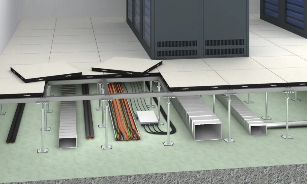 Illustration of a Raised Access Floor with open panels showing cabling, ventilation ducts and support structure beneath the floor.