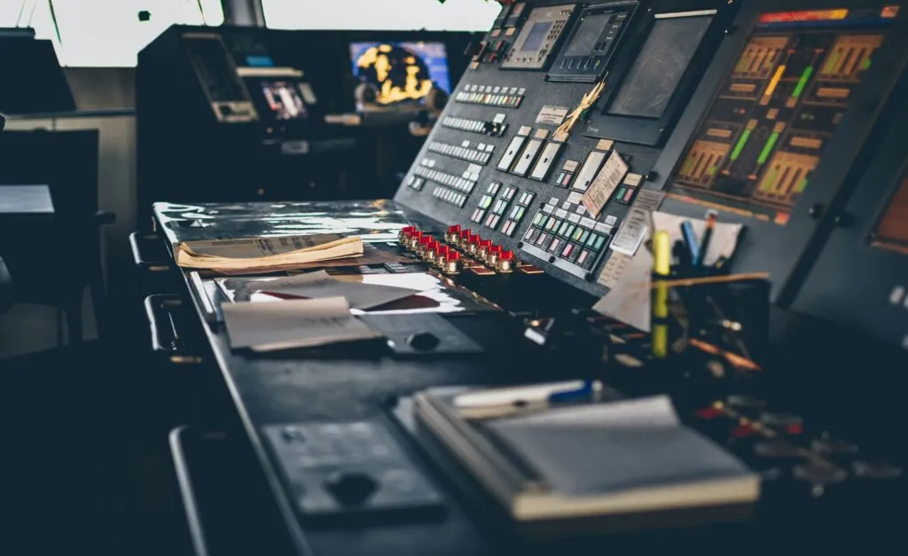 Control room onboard a maritime vessel with instrument panels and technical equipment used in maritime installations.